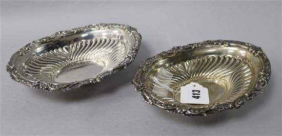 A pair of late Victorian repousse silver oval bonbon dishes by Mark Willis, Sheffield, 1893, 9 oz.